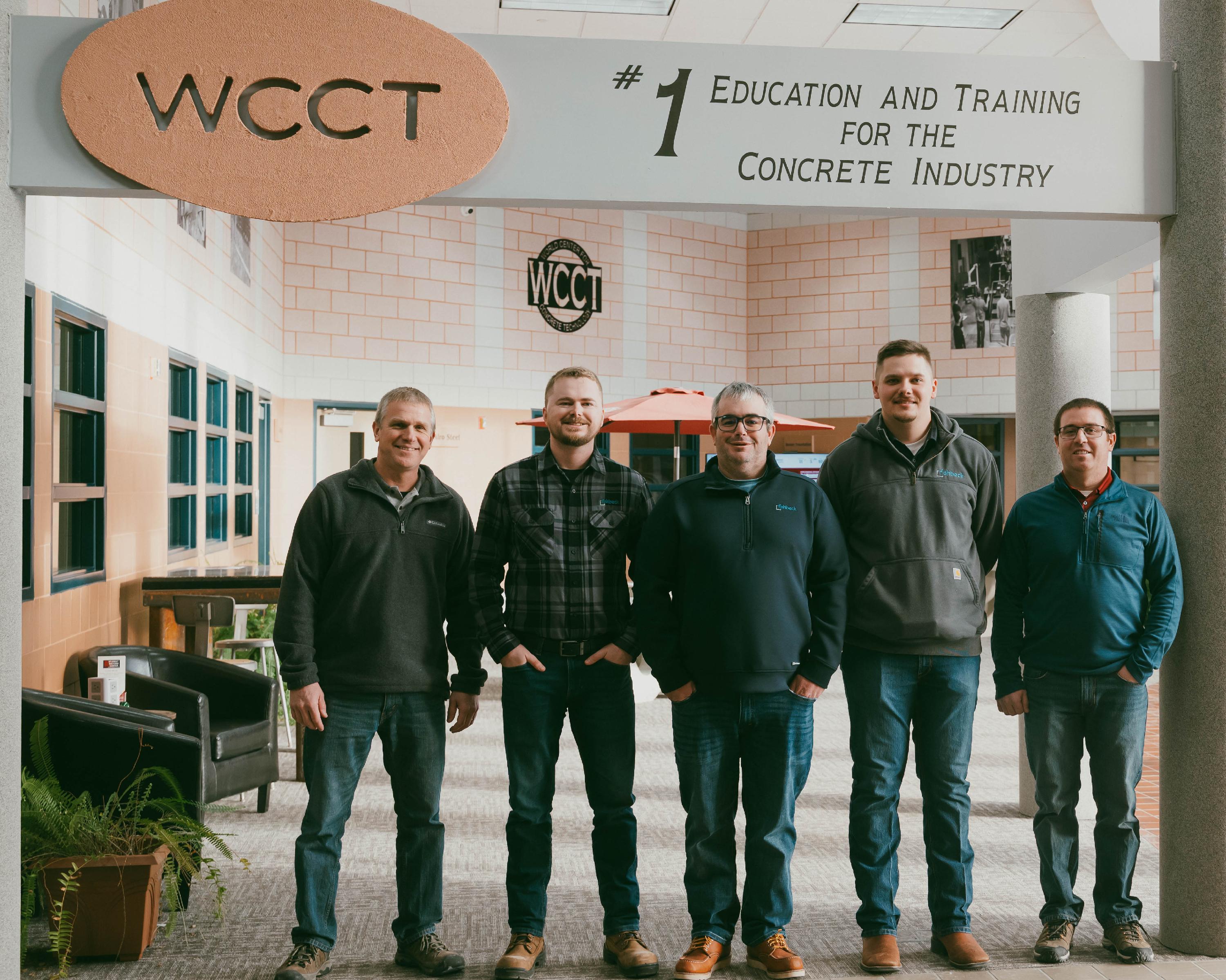Concrete Tech instructors with two concrete tech program graduates and their employer.